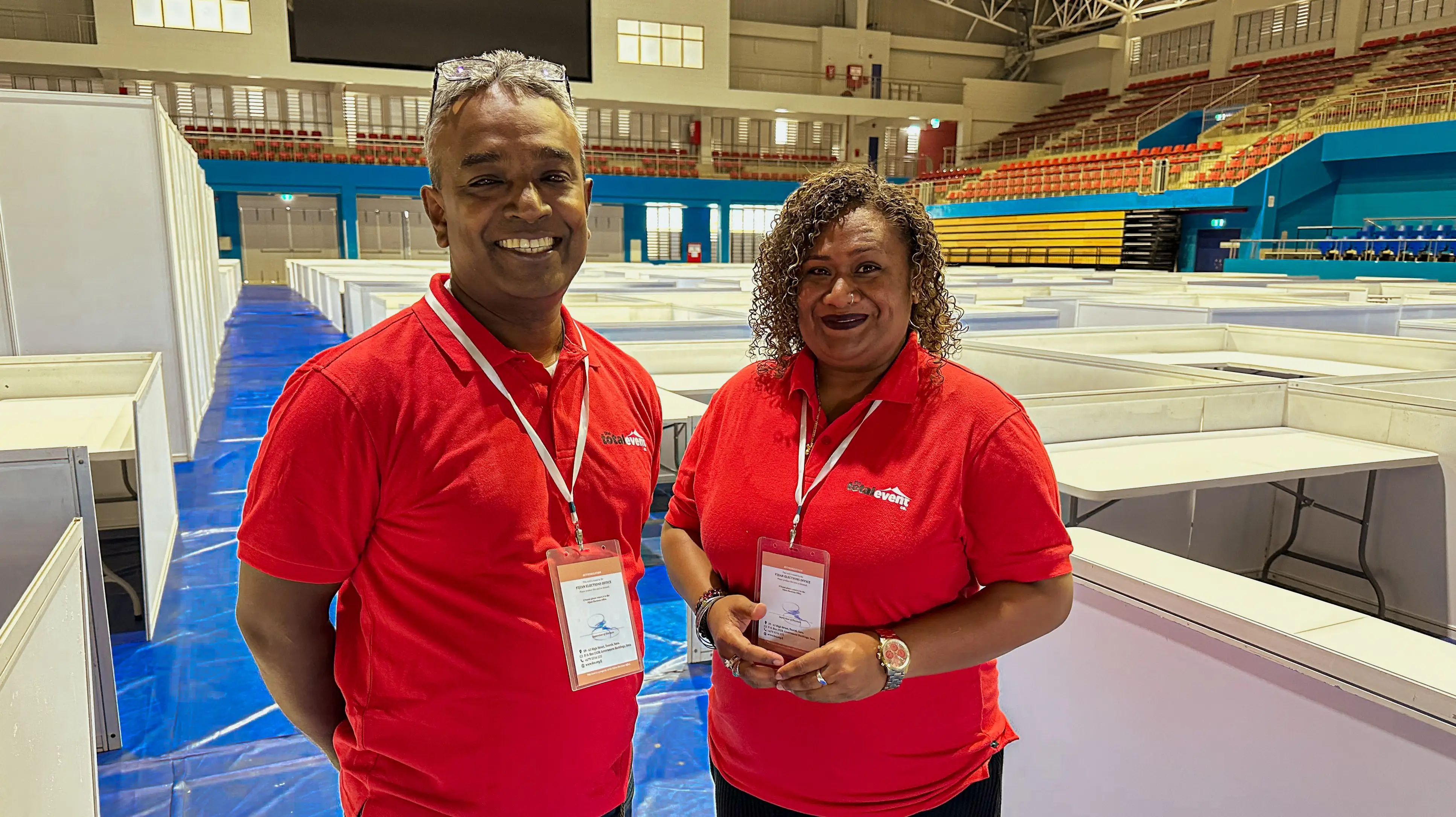 Two Total Event Company team members at an exhibition venue